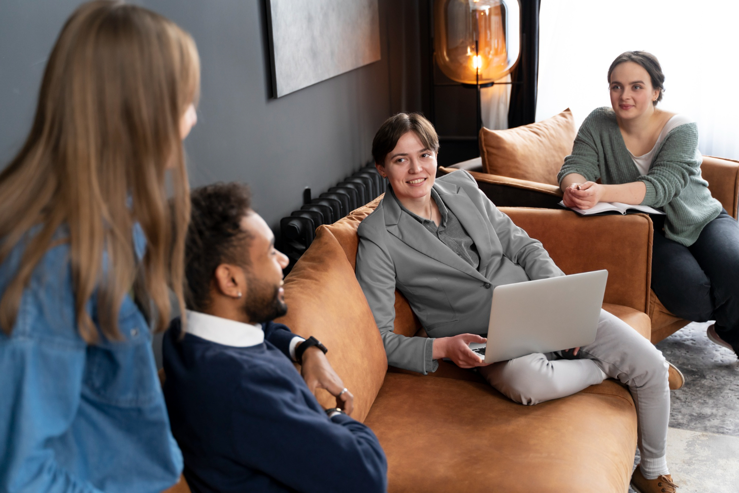 Behaviour support practitioner from Wellness Care discussing a positive behaviour support plan with an NDIS participant and family in Melbourne.