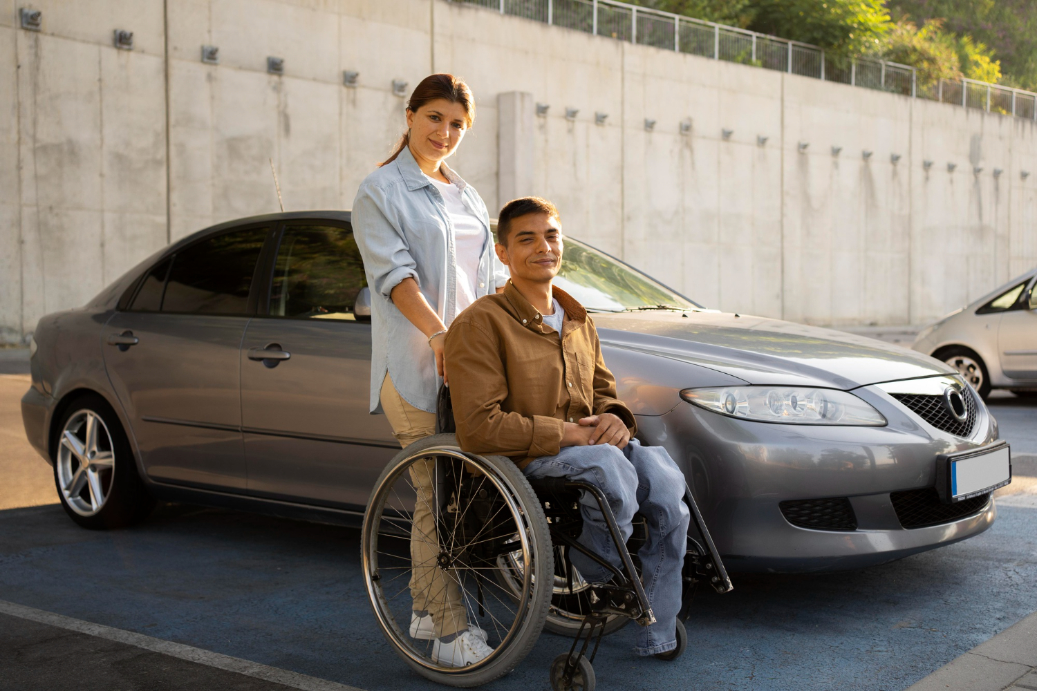 Support worker assisting an NDIS participant into a vehicle for transport to an appointment in Melbourne